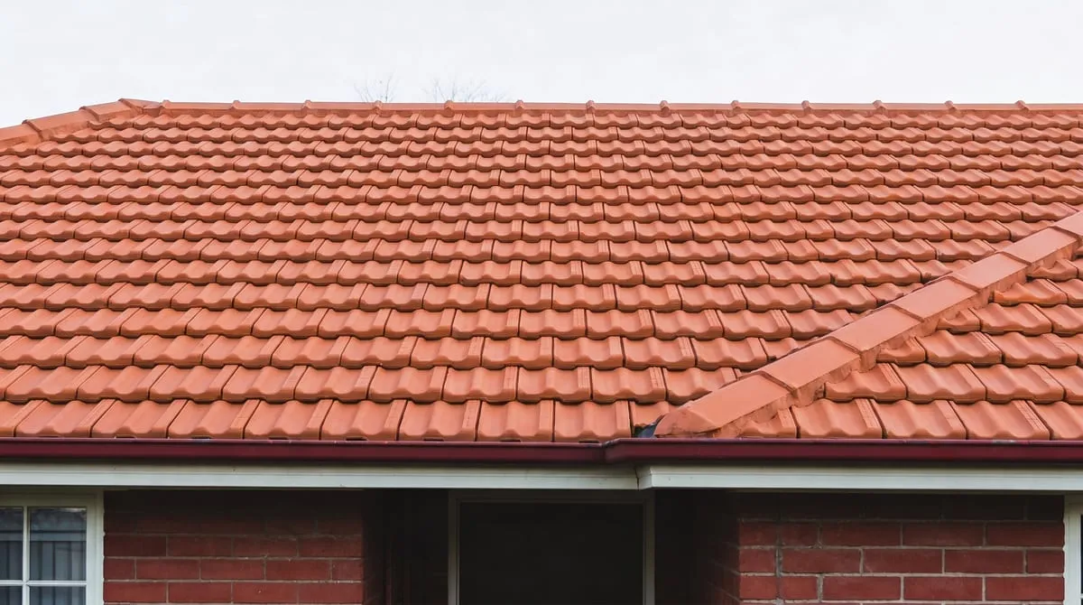 The same tiled roof clean and moss-free after professional roof cleaning